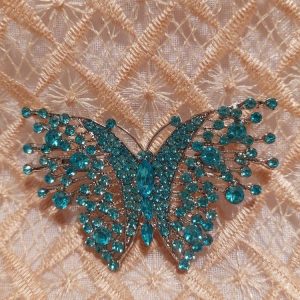 Kaunis, kimalteleva Rintakoru, turkoosi Perhonen