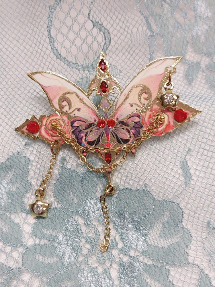 Kaunis Rintakoru, Taideperhonen