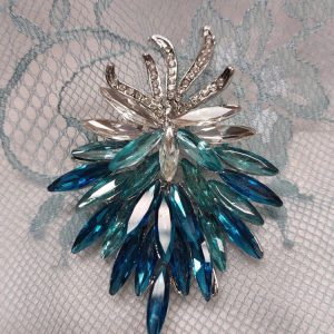 Kaunis Rintakoru, Sini-turkoosi kukkaterttu