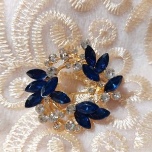 Kaunis Rintakoru, Sini-hopea Kranssi